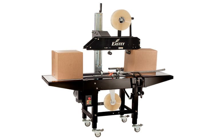 Box sealing machine with two cardboard boxes.