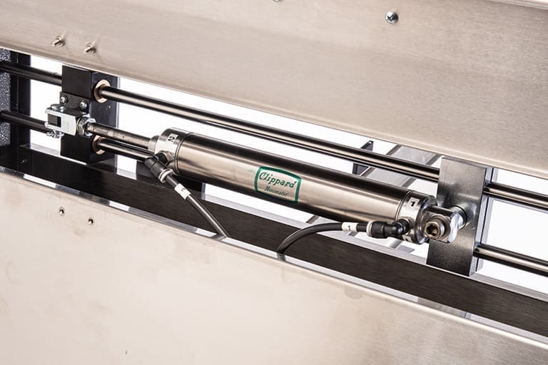 Pneumatic pusher arm of the VCTS vertical case transport system