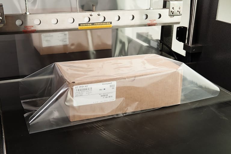 Lower seal bar for shrink wrapping