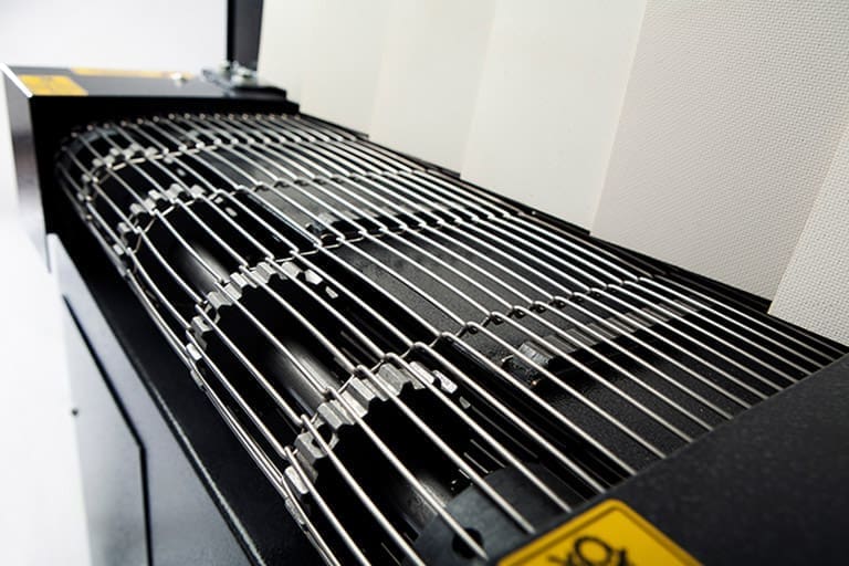 Stainless steel mesh belt conveyor on an Eastey shrink tunnel