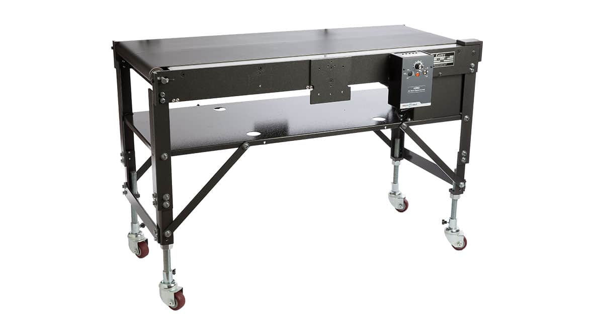 Conveyor belt machine with wheels and controls.