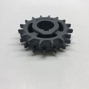 Gray plastic gear with center hole.