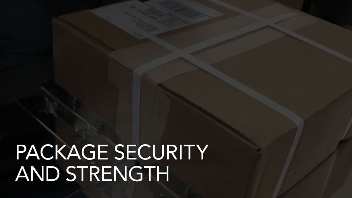 Box with white straps labeled package security.