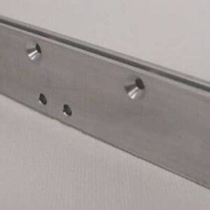 Metal bracket with multiple drilled holes.