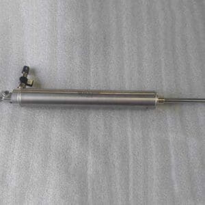 Hydraulic cylinder on a textured surface.