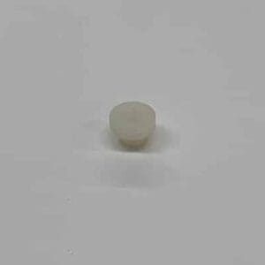 Here's an alt tag for the image: White plastic push-in fastener.