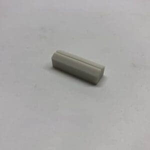 White rectangular plastic component.