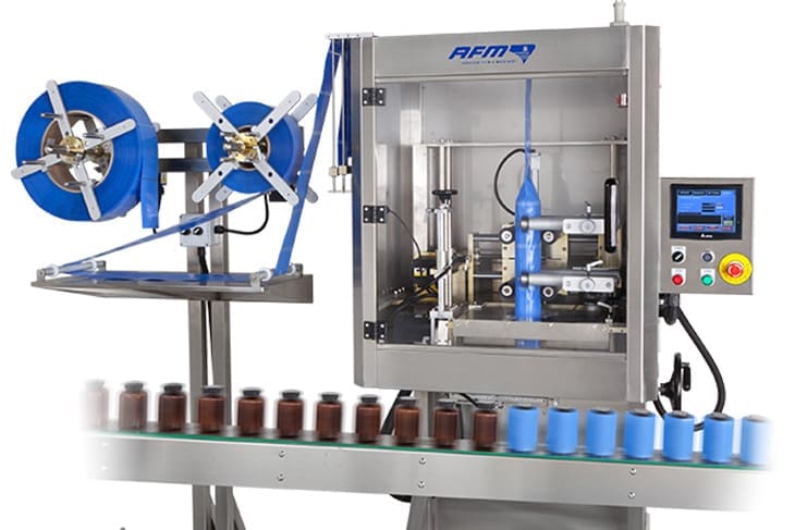 Automated packaging machine with conveyor system.