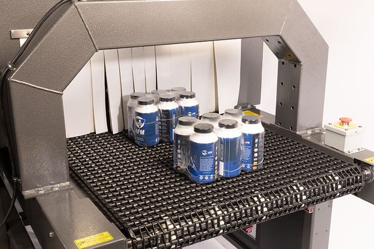 Shrink wrapped bundle of products on the ECB25A