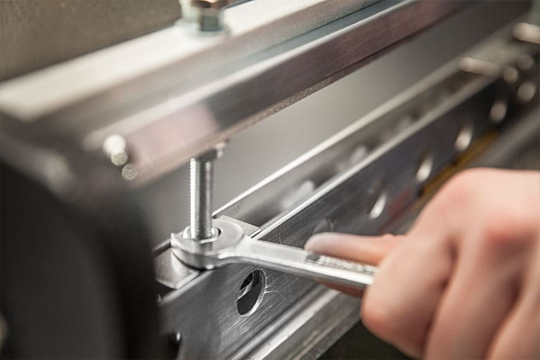 Close up of a technician working on an Eastey packaging machine