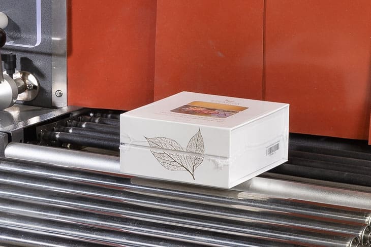 A finished shrink wrapped product on an Eastey conveyor