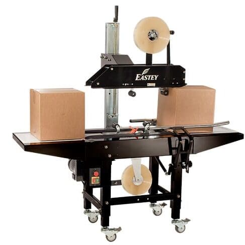 Box sealing machine with two cardboard boxes.